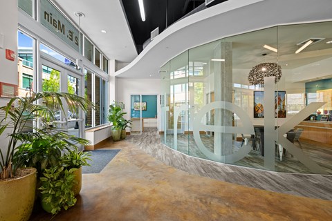 the lobby of a building with a large peace sign in the middle