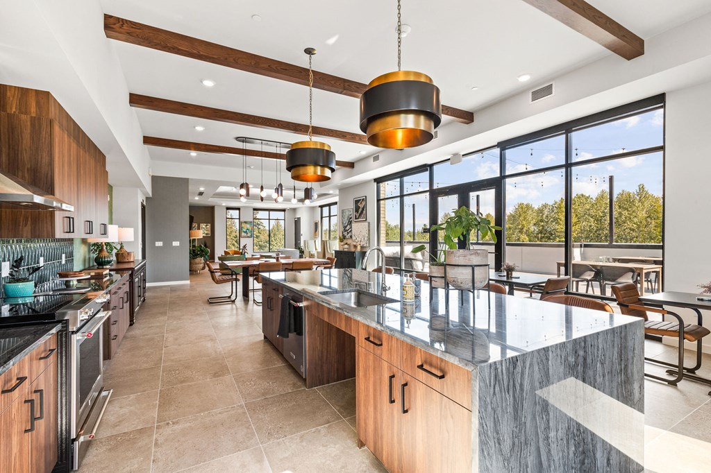a large kitchen with a large island and a dining area