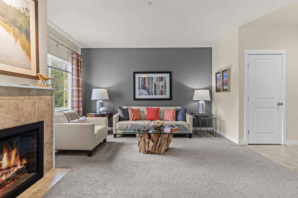 a living room with a fireplace and a couch