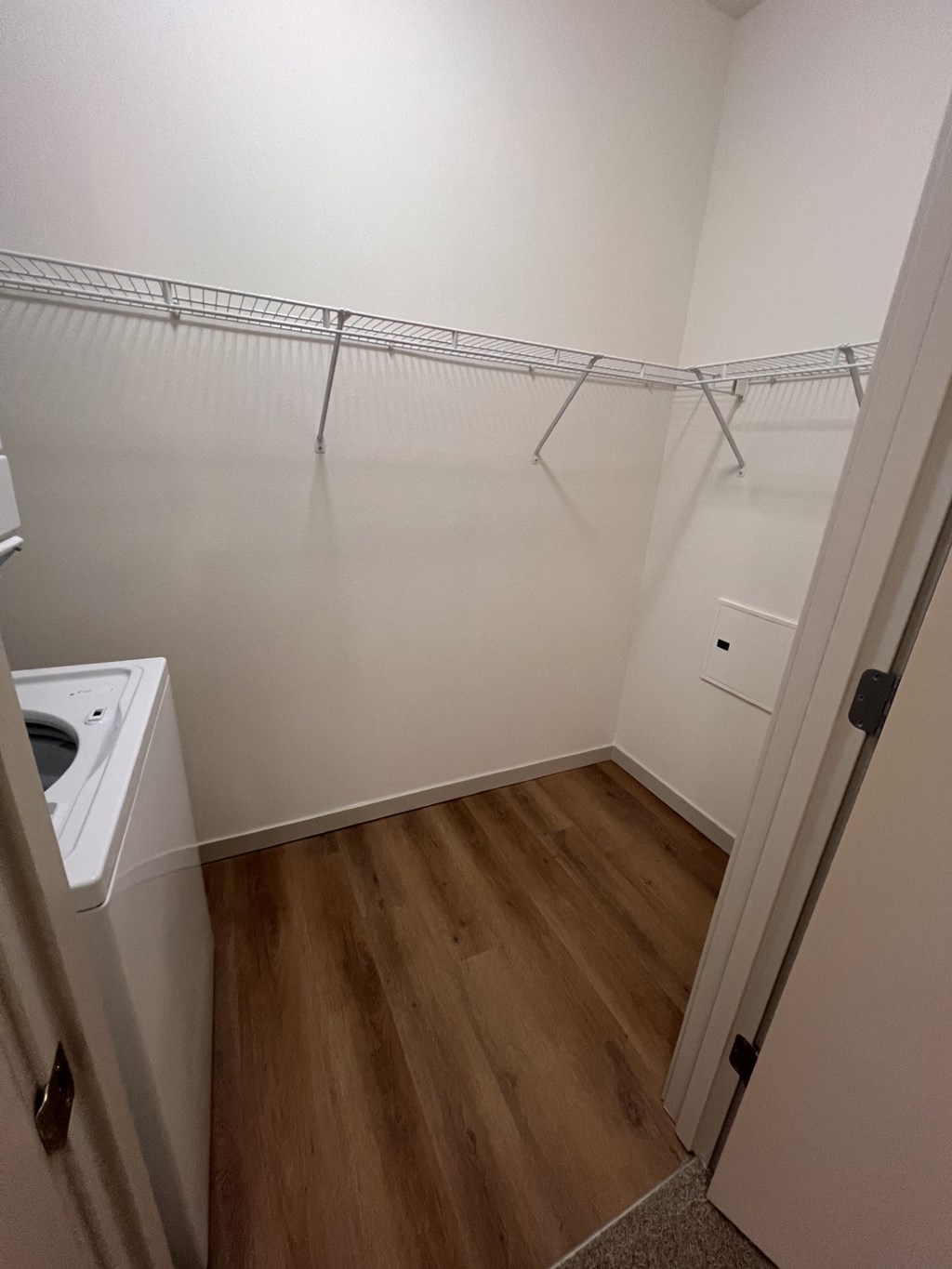 an empty laundry room with a washer and dryer