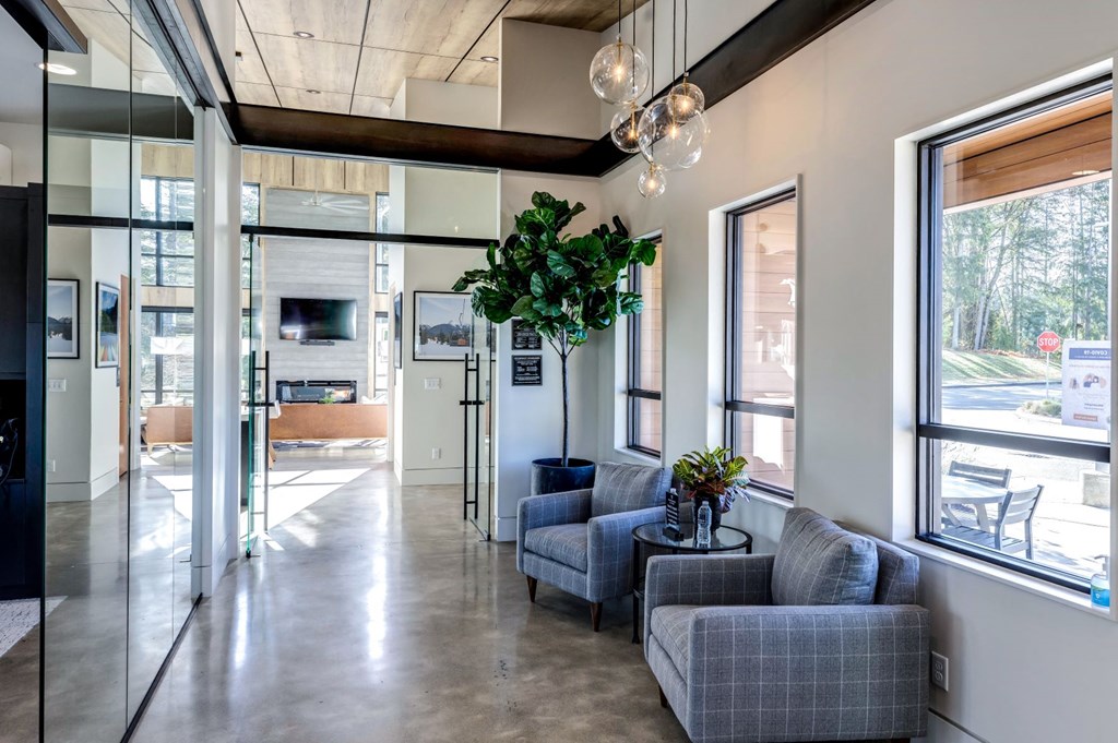 a living room with couches and a table in a lobby