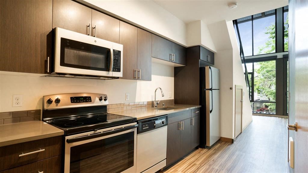 a kitchen with a stove and a microwave