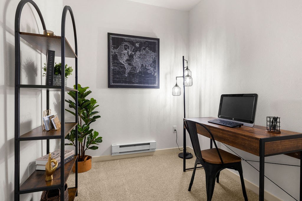 a home office with a desk and a computer