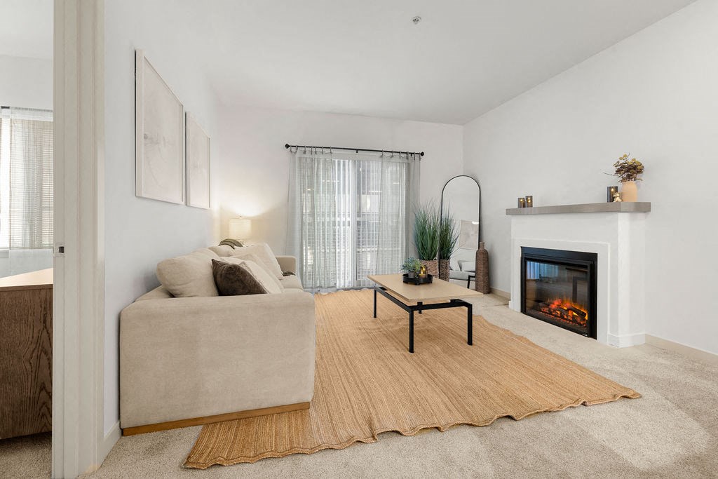 a living room with a couch and a fireplace