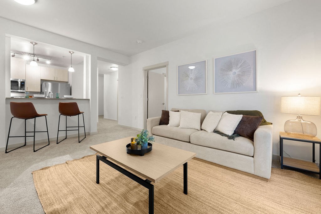 a living room with a couch and a table