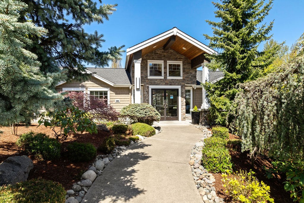 a home with a pathway leading up to the front door