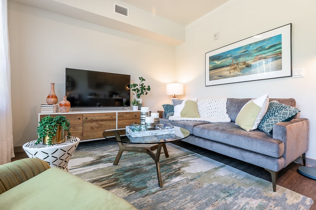 a living room with a couch and a tv