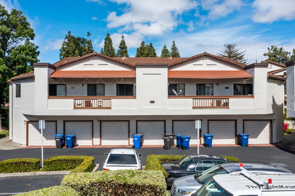 a picture of the front of a building with a parking lot in front of it at Greentree Terrace Apartments, California