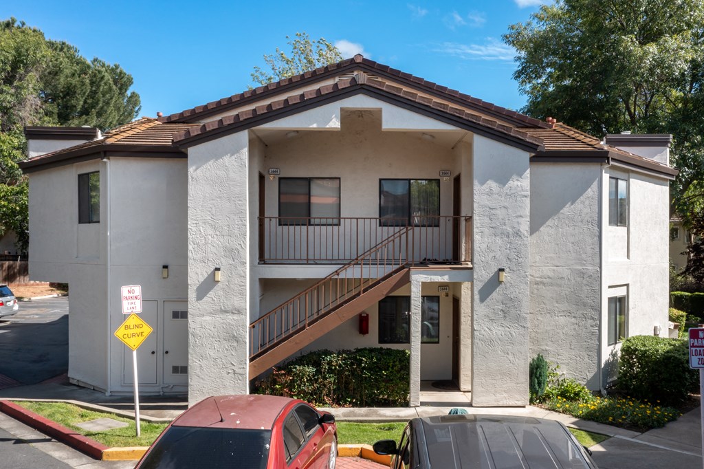 a white building with car parking at Greentree Terrace Apartments, CONCORD
