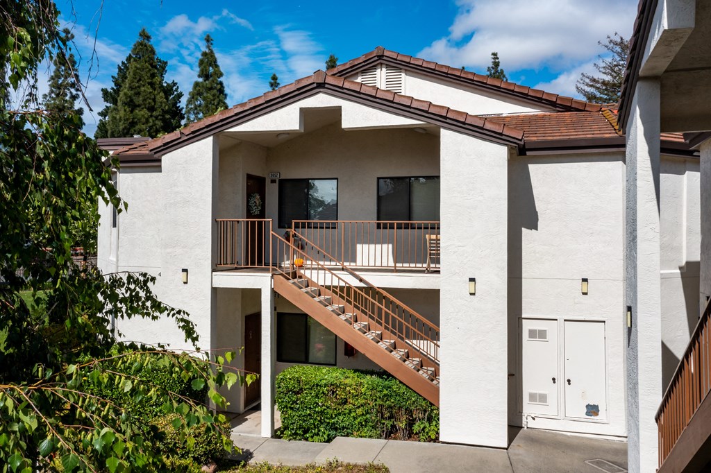 a white house with a brown roof at Greentree Terrace Apartments, CONCORD