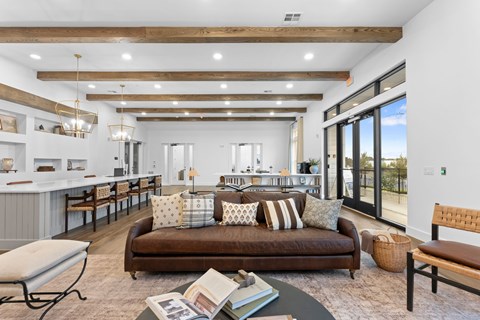 A modern living room with a brown sofa and a wooden coffee table.