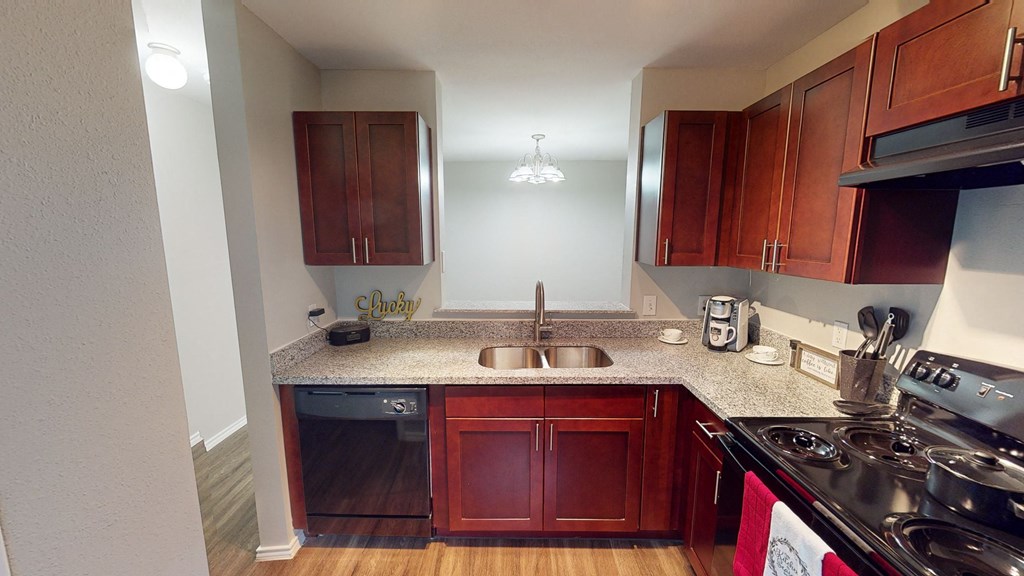a kitchen with a counter top and a sink