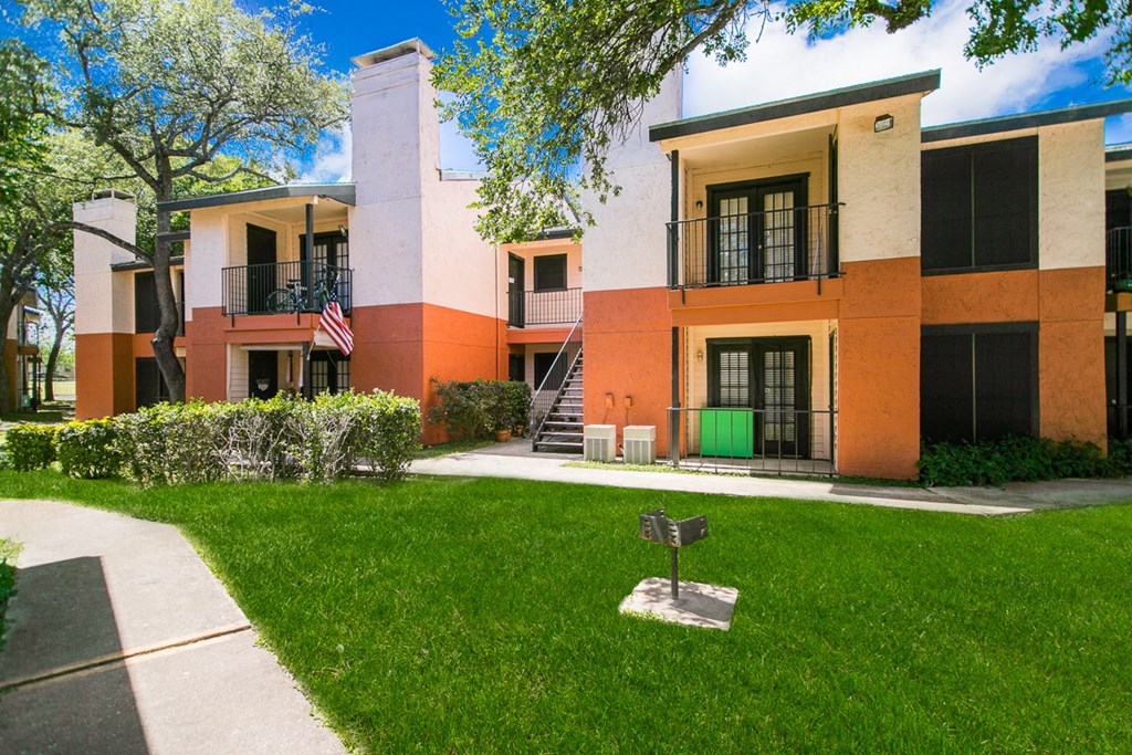 Building exterior with grill in greenspace