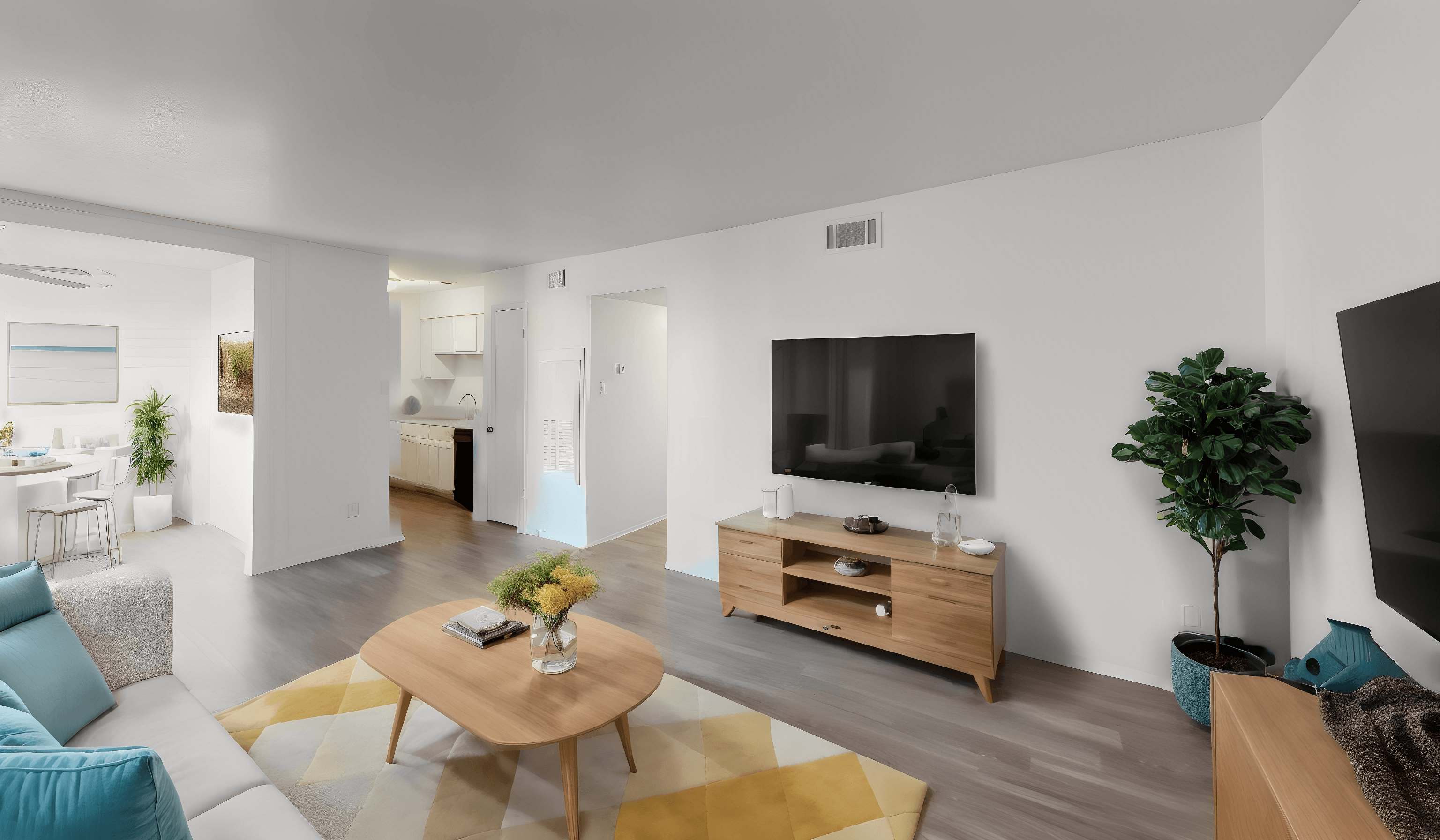 a living room with a couch and a table and a television