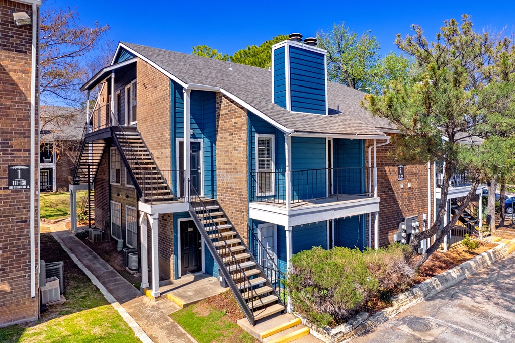 a blue house with a blue chimney on top of it