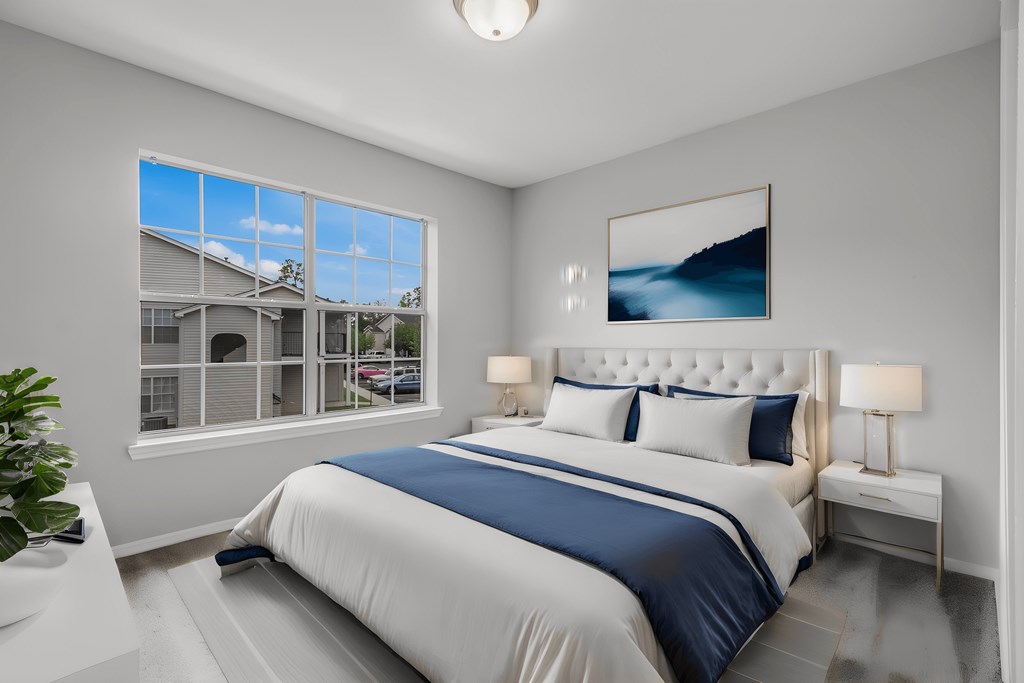 a bedroom with a bed and a window