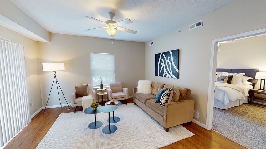 a living room with a couch and two chairs - Photo Gallery 1