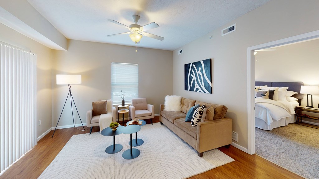 a living room with a couch and two chairs