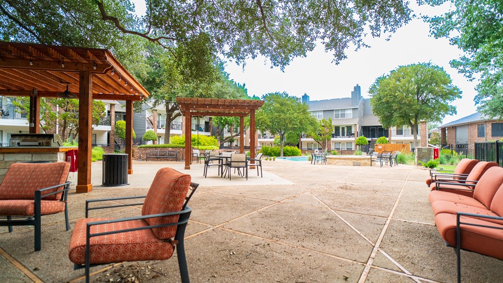 a large patio with chairs and umbrellas