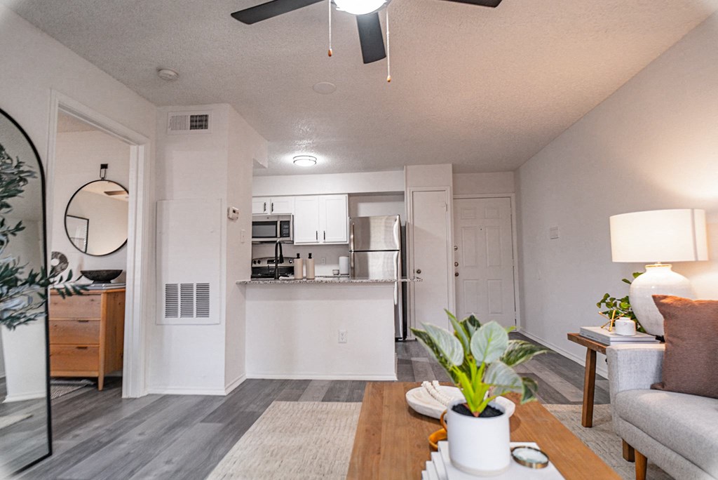 an open living room and kitchen with a couch and a table