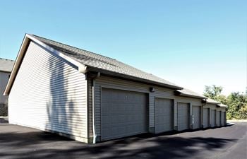 a row of garages in a parking lot