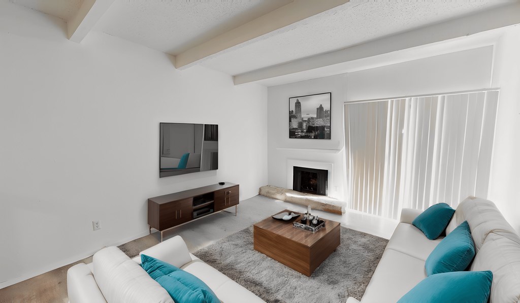 a living room with a white couch and a coffee table