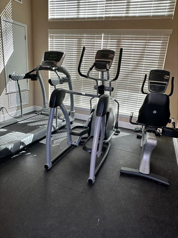 a group of exercise bikes in a gym