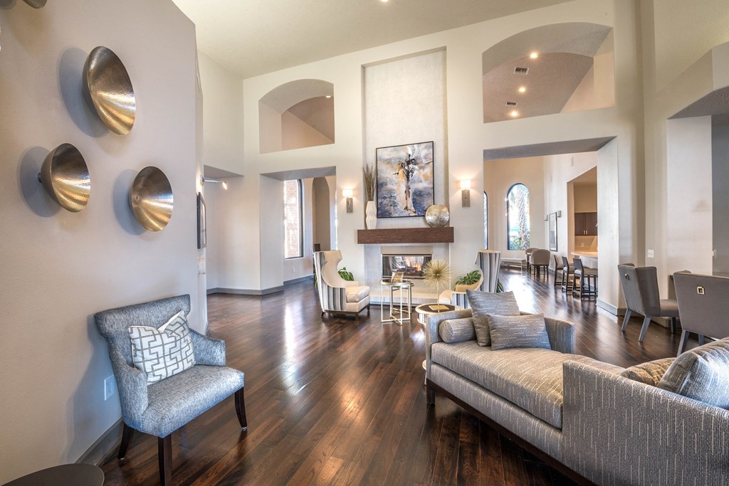 a living room with couches and chairs and a fireplace