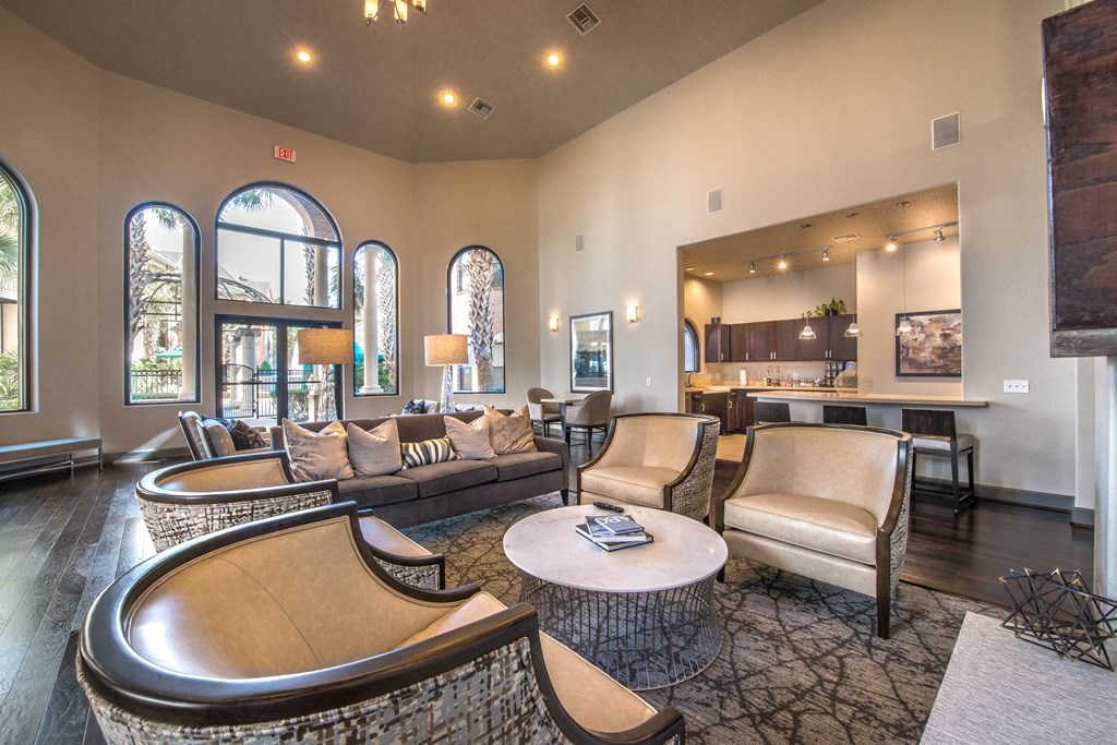 a living room with couches and chairs and a table