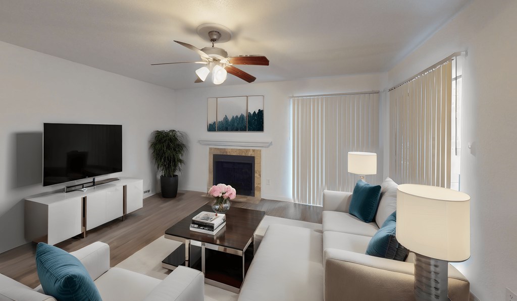 a living room with a white couch and a coffee table