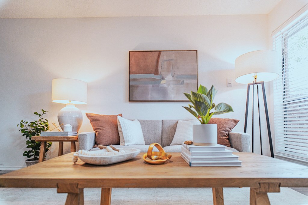 a living room with a couch and a wooden table