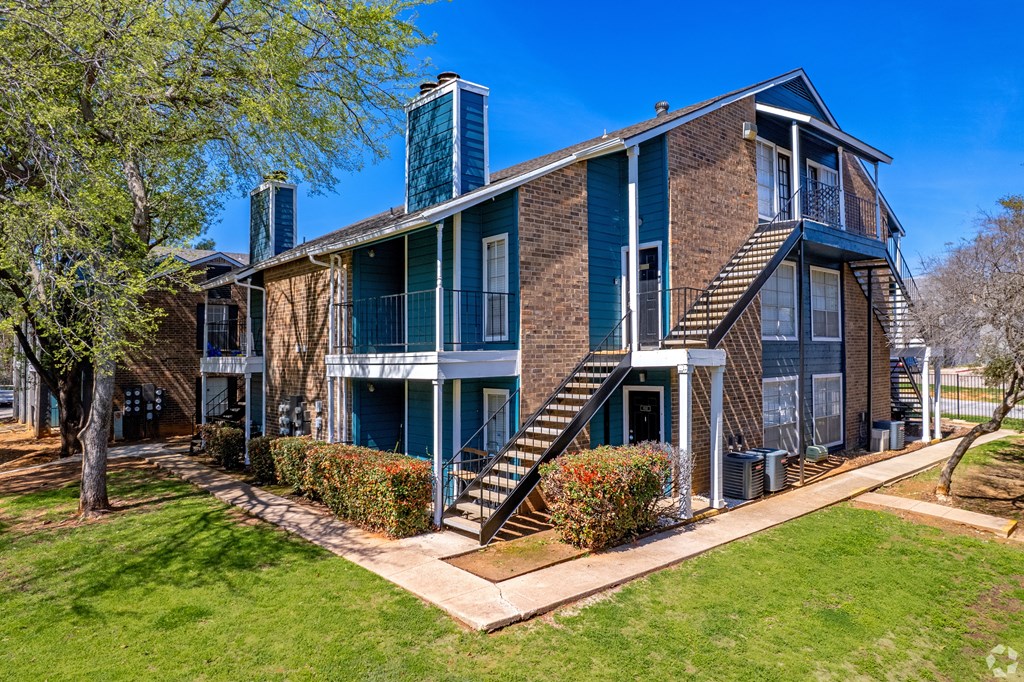 A large house with a staircase leading to the second floor.