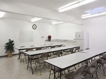 a room filled with lots of tables and chairs