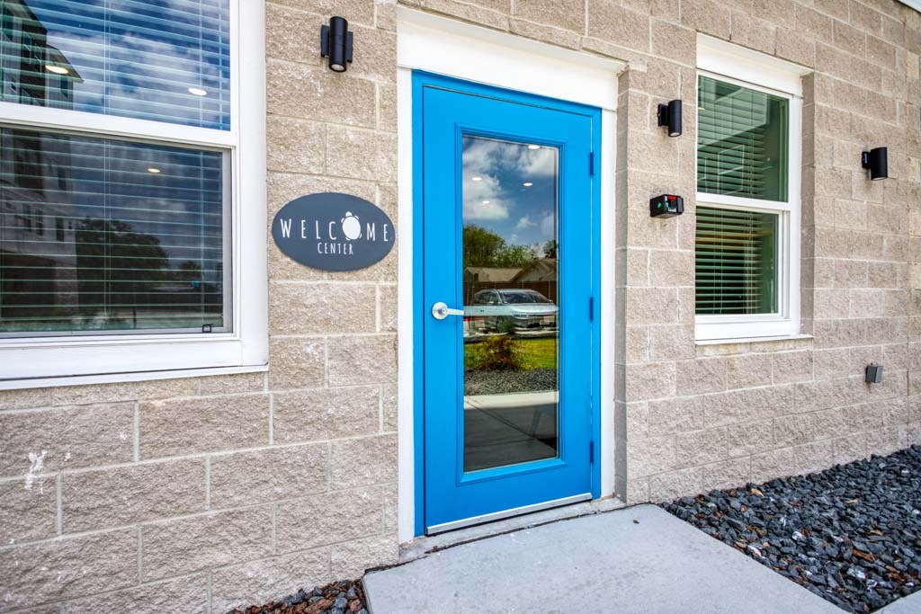 a reflection of a person in a glass door