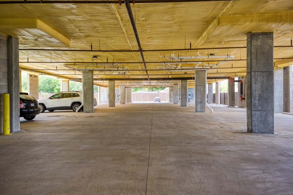 a parking garage with cars parked in it