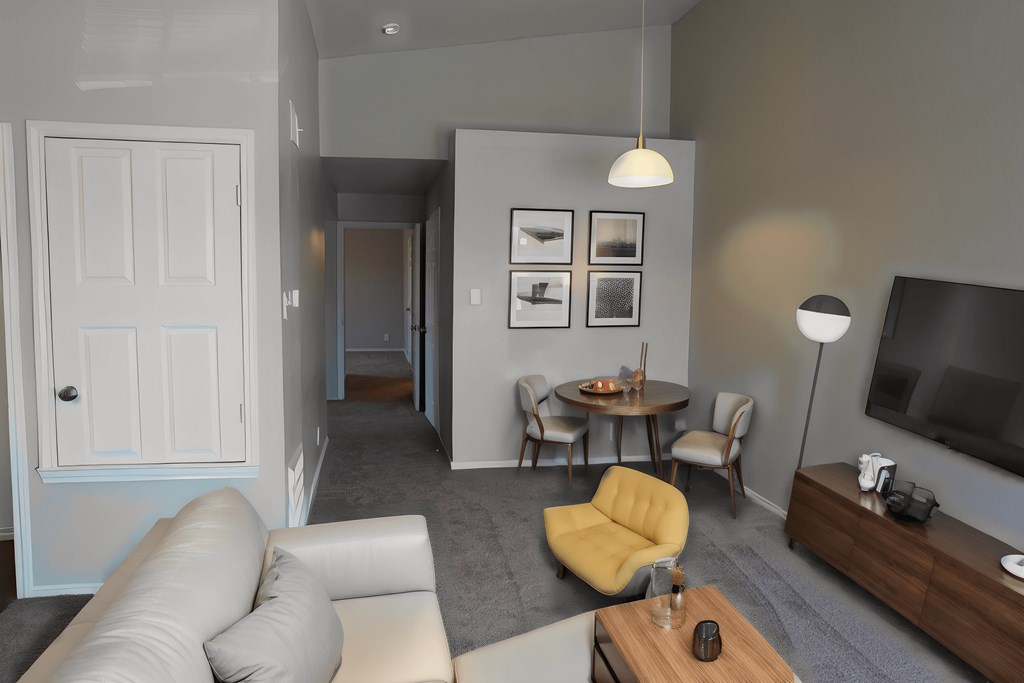 a living room with a couch and a table and a television