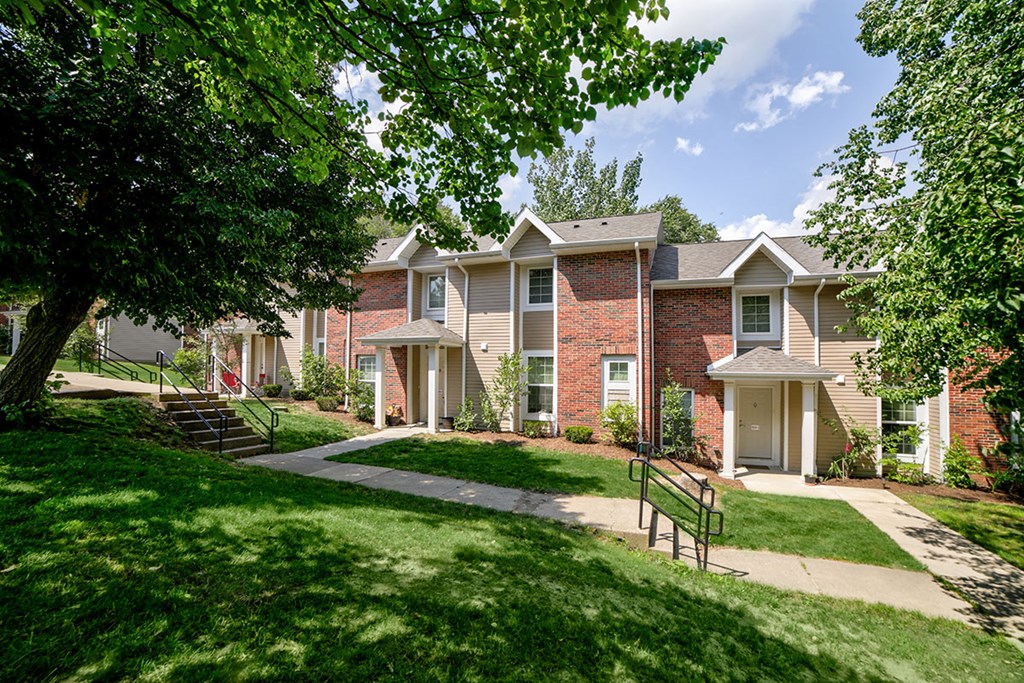 exterior building brick townhomes with sidewalk