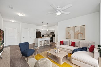 Living room in three bedroom apartment at The Village at Blenheim Run - Photo Gallery 3