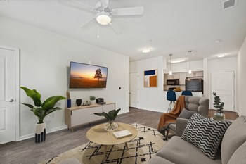 Living room in one bedroom apartment at The Village at Blenheim Run - Photo Gallery 7