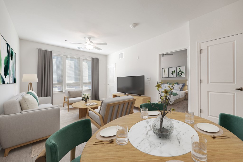A modern dining room with a wooden table set for two.