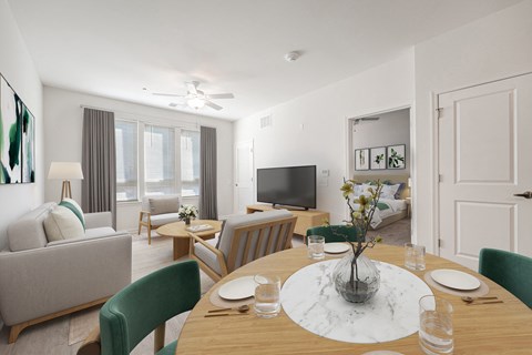 A modern dining room with a wooden table set for two.