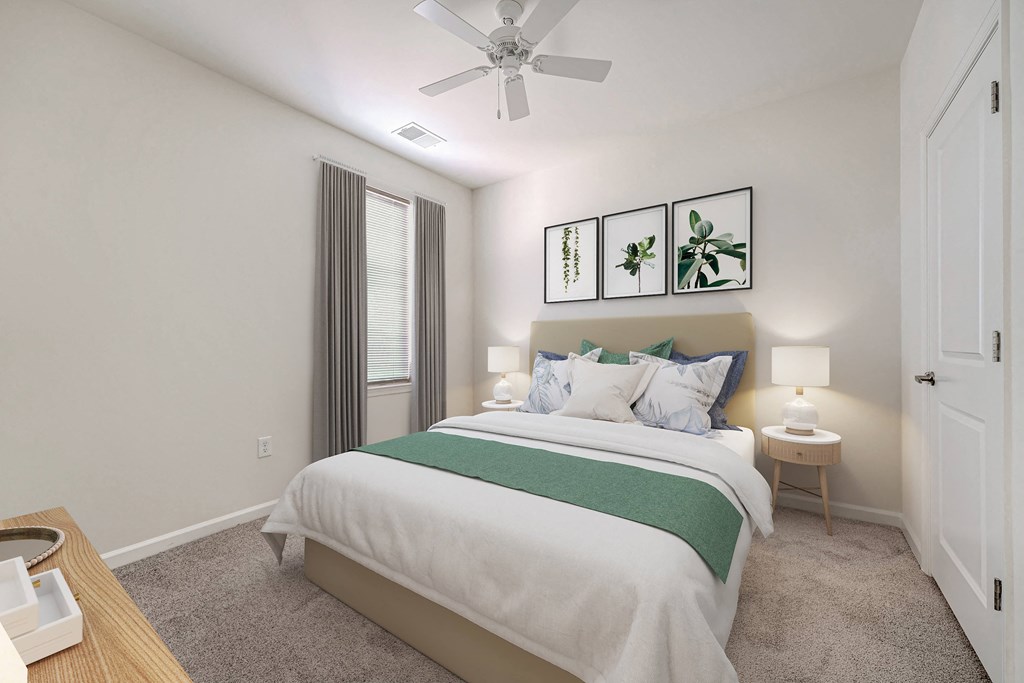 A bedroom with a bed, nightstand, and a ceiling fan.