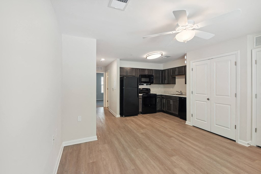 a renovated living room and kitchen in a new home