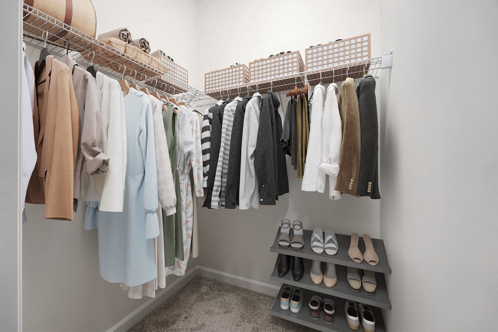 A closet with clothes and shoes.
