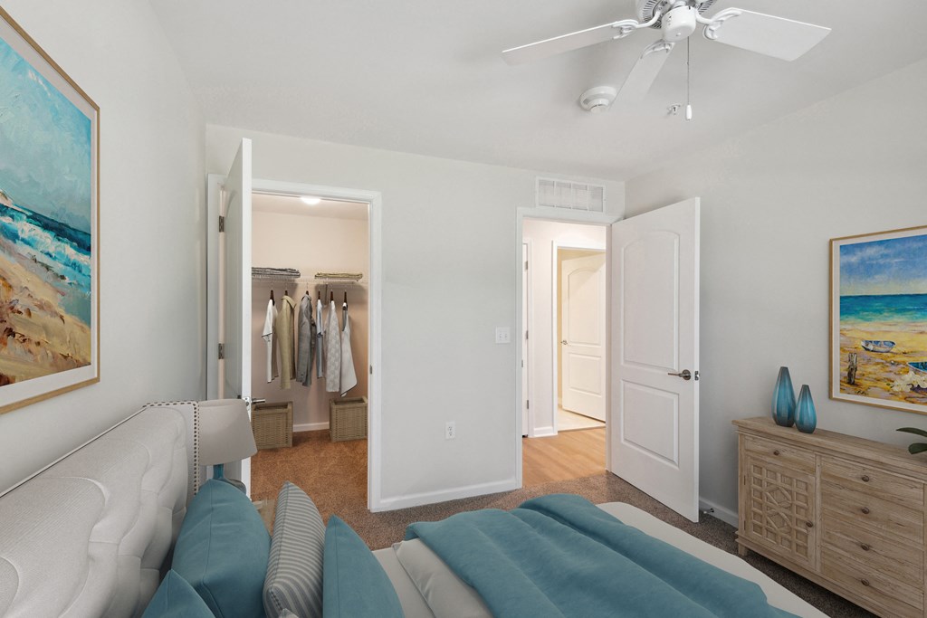 a living room with a couch and a ceiling fan