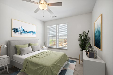 a bedroom with a green bed and a ceiling fan
