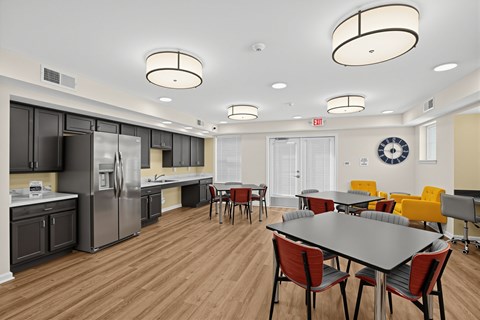 A modern kitchen with a dining table and chairs.