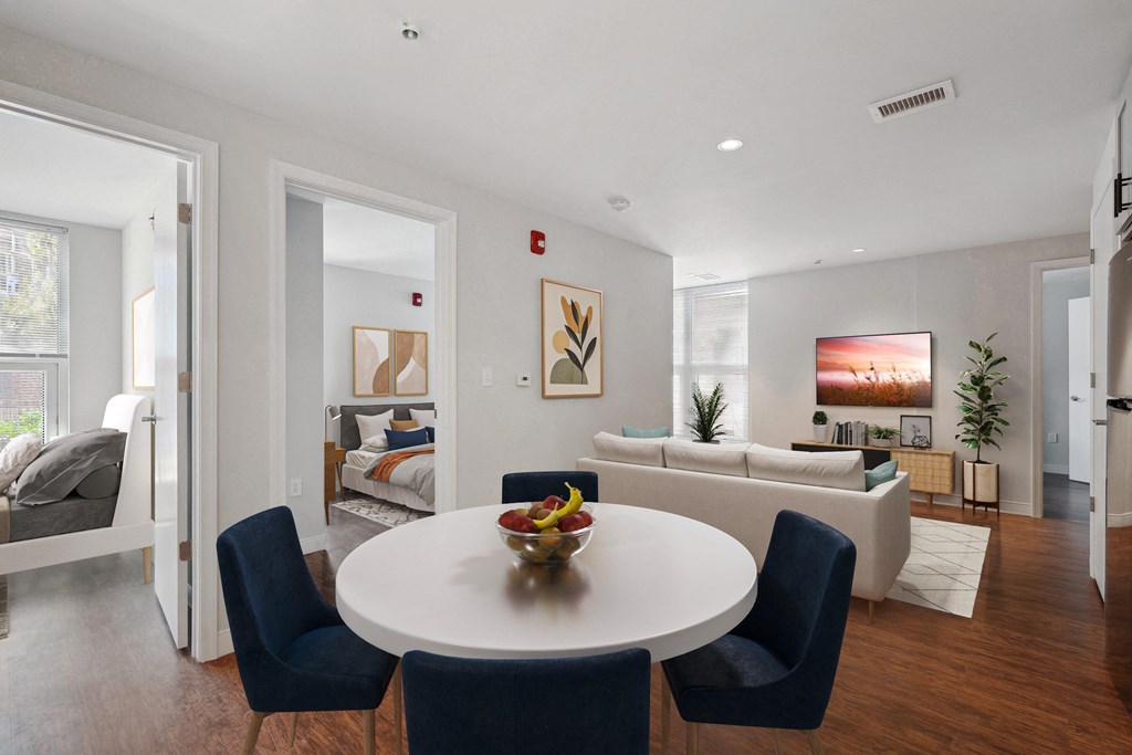 a living room with a white table and chairs