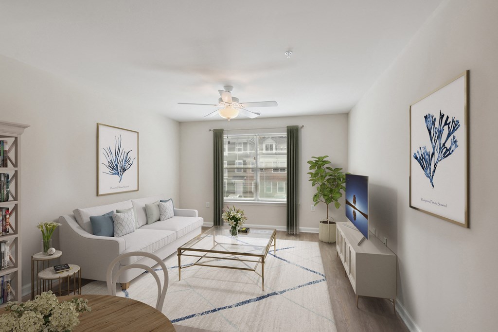 a living room with a white couch and a table