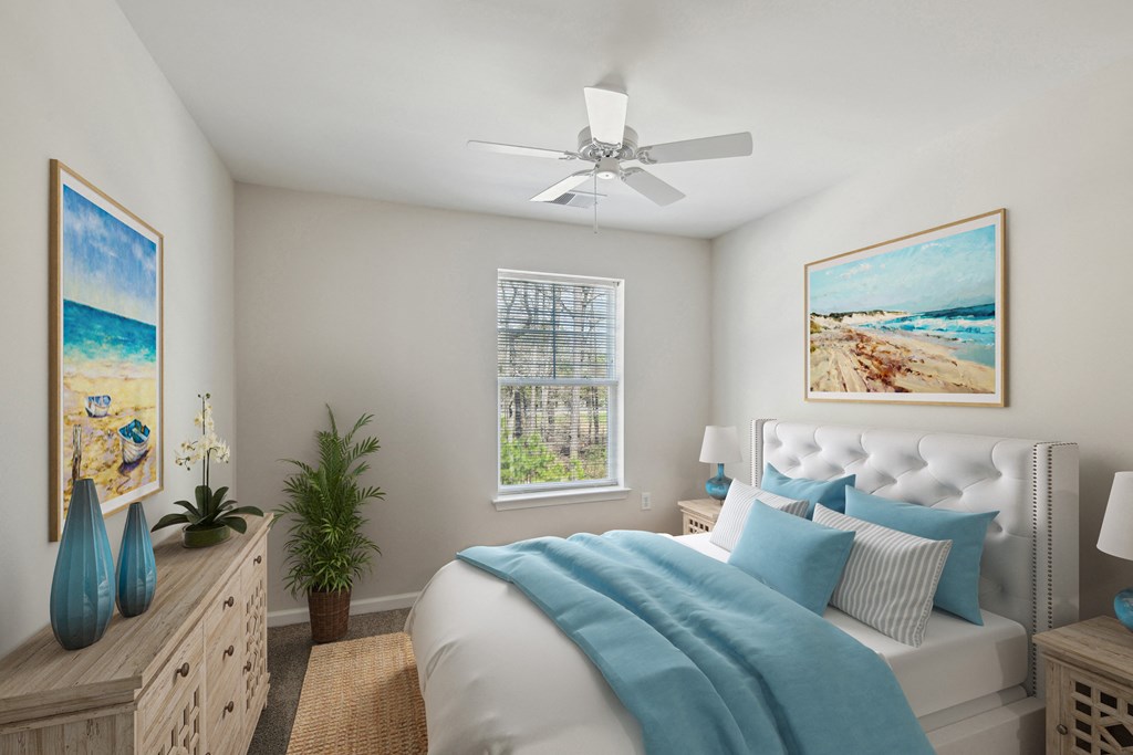 a bedroom with a bed and a ceiling fan